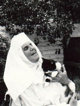 sister seraphim and cat b&w portrait