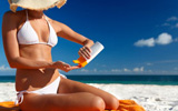 woman applying sunscreen