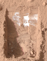 Dice-size crumbs of bright material have vanished from inside a trench