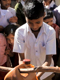 A student from the primary school in Pachputewadi demonstrates the school's Tippy Tap to other students.