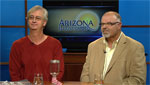 Craig Wilson (left) merchant and Kurt Tallis a marketing & events director talk about the upcoming 4th Ave Street Fair.