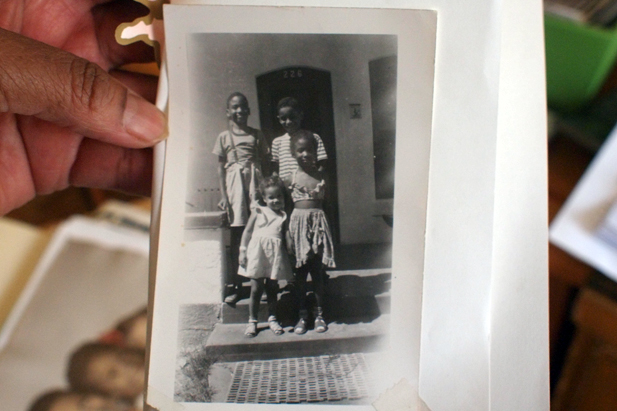 Rita Elliot holds picture (Arizona Public Media)