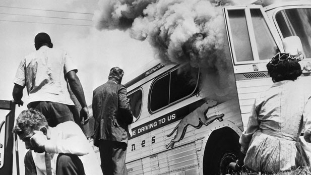 In Anniston, Alabama, an angry mob stoned and firebombed the Greyhound bus holding some of the original Freedom Riders.