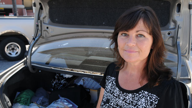 Kim Sisson keeps food, hygiene supplies and clothing for homeless youth in the trunk of her car.