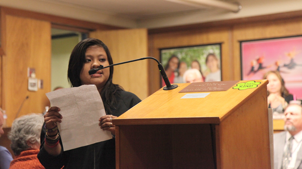 Mayra Feliciano, a TUSD graduate speaks during the call of the audience portion of the meeting. She turns her back to the governing board because “they haven’t listened” and instead addresses the crowd at Tuesday’s meeting.