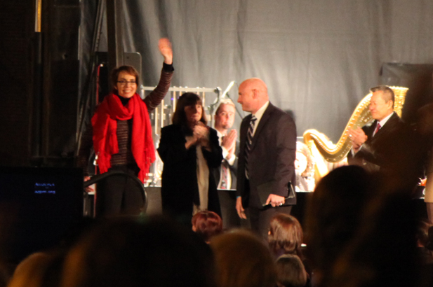 Gabrielle Giffords waving to the crowd at a Jan. 8, 2012 anniversary vigil of the shooting that took six lives and left her and 12 others wounded.