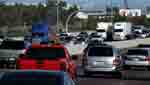 10/29/12. Rebecca Brukman.
Image of vehicles stuck in traffic on both sides of freeway.