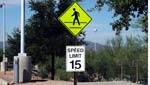 10/3/12. Rebecca Brukman.
15 MPH Speed Limit sign and Pedestrian Crossing sign.