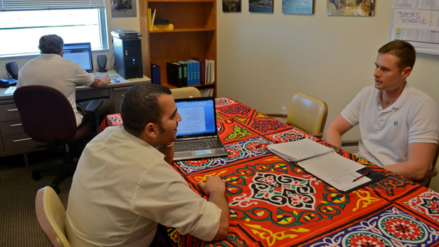 Tutor Mudhafar al-Husseini works with David Forsythe, a US Air Force ROTC student, on an Arabic assignment. Project GO, which the duo are part of, works with more than a dozen ROTC students on Arabic language and culture.