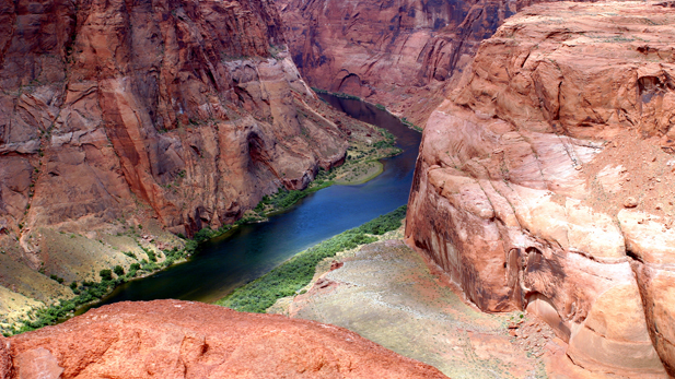 By the time the Colorado River reaches the soft sandstone of southern Utah, it is a large, powerful river, cutting deep gorges into the Colorado Plateau. 