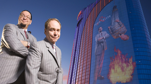 Penn Jillette and Teller stand outside their theater at the Rio Hotel in Las Vegas, Nevada.