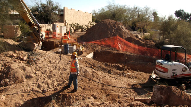 Stock construction workers on site Spotlight