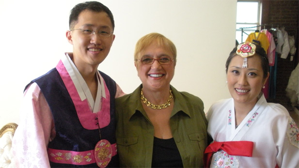 Celebrity chef, restaurateur, and culinary author Lidia Bastianich poses with a Korean-American couple on their wedding day.