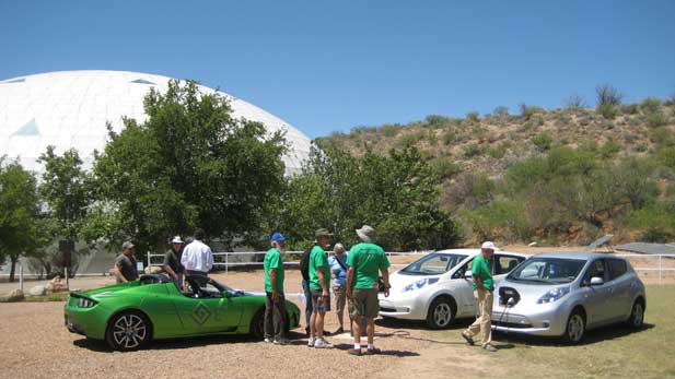 The Biosphere 2 Model City research facility in Oracle, Arizona: Saturday, April 21, 2012. Members of the Tucson Electric Vehicle Association, TEVA2, visit with Biosphere 2 staff and officials from GoE3, an Arizona-based company that has promised to deploy 500 of their modular quick chargers across US highways over the next 18 to 30 months. Two Nissan Leafs and a Tesla Roadster is also shown.  

 