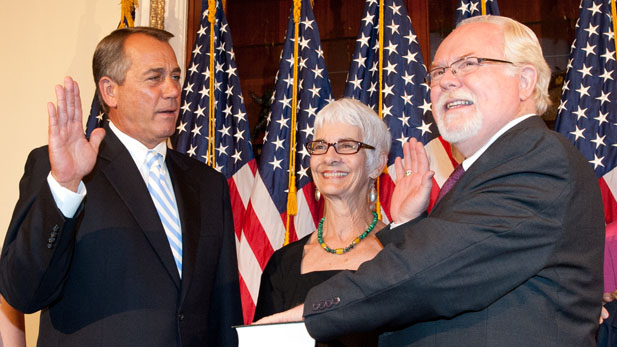 House Speaker John Boehner (R-Ohio) swears in Ron Barber (D-Arizona) June 19, 2012. Barber's wife, Nancy, joined them for the ceremony.