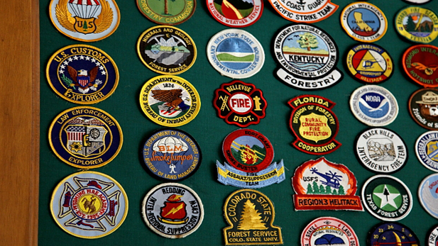 Patches commemorating various firefighting efforts adorn the NAFRI walls.