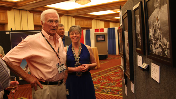 Apollo Astronaut Gene Cernan was the last man to walk on the moon. Here, he looks at lunar artwork with the artist, Pamela Lee in Tucson May 31, 2012.