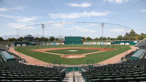 Crews work on the field at Kino Stadium during an off day.