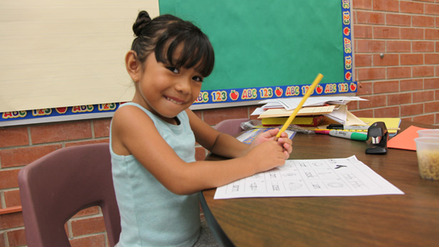 Five-year-old Isabella Goff-Quiroga working on a vocabulary lesson at the Jump Start summer program.