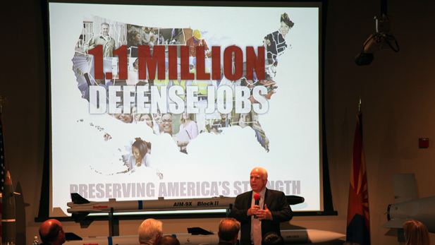 U.S. Sen. John McCain, R-Ariz., talks with Raytheon employees in Tucson about automatic budget cuts to the Department of Defense, set to go into effect Jan. 1, 2012.