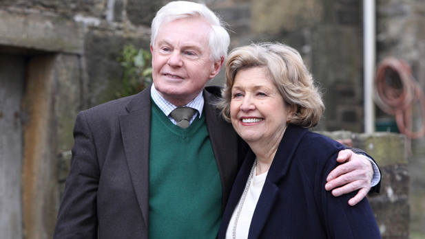 Alan (DEREK JACOBI) and Celia (ANNE REID) outside the farm