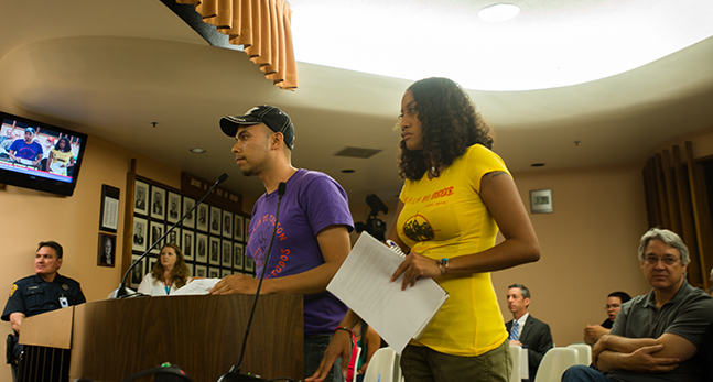 Leilani Clark, who said she was pepper sprayed at the Oct. 8 immigrant rights protest scene, prepares to address the City Council.