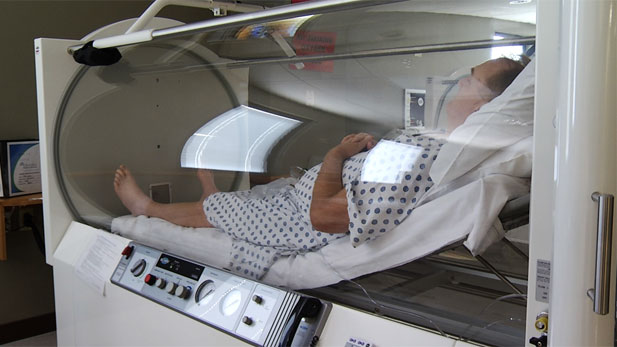 Rick Lepared receives hyperbaric therapy, an oxygen treatment used to help increase healing time, for his osteomyelitis.