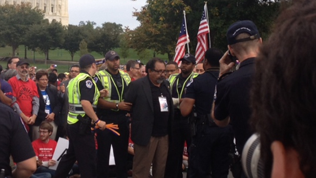 U.S. Rep. Raúl Grijalva, D-Ariz., is taken into custody during demonstration at U.S. Capitol Oct. 8, 2013.