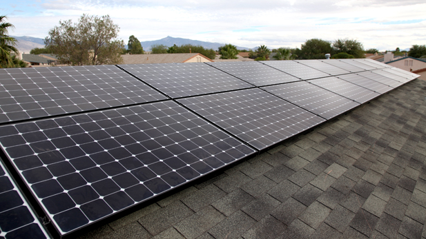 The 25-panel solar power system set-up of the roof of Enrique Ward's home.