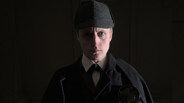 Sherlock's iconic cap, cloak and magnifying glass