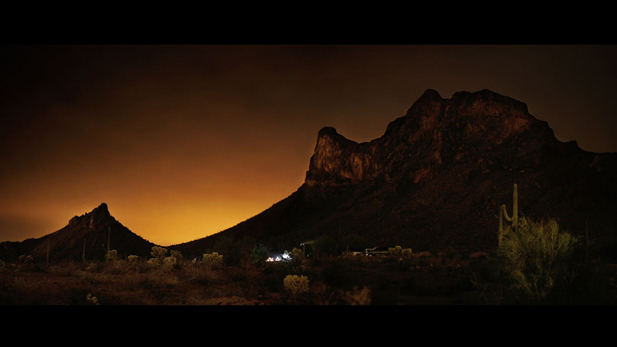 A time lapse photograph of light pollution from Tucson reaching the Picacho Peak night sky.   