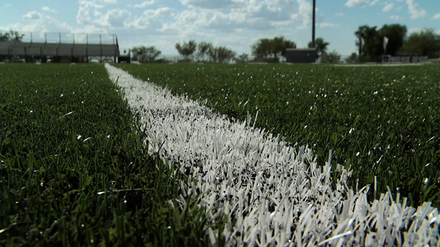 An artificial turf field is being used at many local high schools in place of real grass fields. 