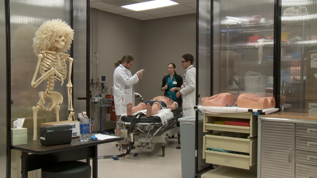 Medical student J.P. Jarczyk practices administering epinephrine in a simulated allergic reaction case. 