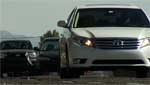Cars drive through Tucson streets during rush hour.