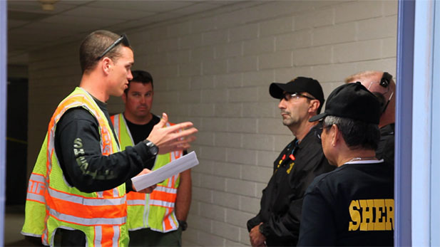 Sherif Joe Arpaio's school safety posse trains in a school shooting practice scenario. 