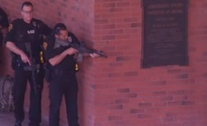 Police with guns at admin bldg focus