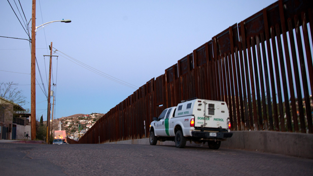 A U.S. Border Patrol vehicle on the American side of the border fence in Nogales, Ariz.