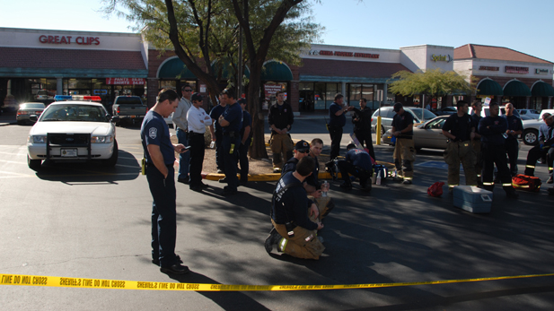 First responders in the parking lot of the shopping center at North Oracle Road and West Ina Road after the shooting on Jan. 8, 2011.