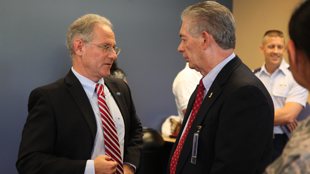 Tucson Mayor Jonathan Rothschild talks with Mike Grassinger, president of the DM-50, a support organization for Davis-Monthan Air Force Base. The two are working on the city's goal to end veterans' homelessness by 2015.