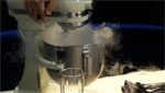Two chefs make ice cream using liquid nitrogen.