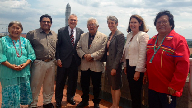 Retired US Sen. Jon Kyl (third from left), White Mountain Apache Chairman Ronnie Lupe (center), US Interior Secretary Sally Jewell (to Lupe's left) and U.S. Rep. Ann Kirkpatrick (second from right) with members of White Mountain Apache Tribe.