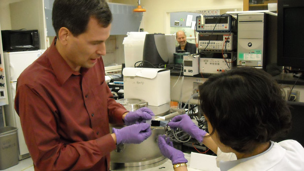 David Pogue and Chihye Lewis looking at carbon nanotube forest.