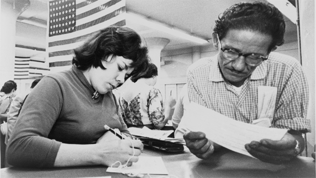 Hilda Hernandez, originally from Aguadilla, Puerto Rico, registers to vote. New York City, 1960. 