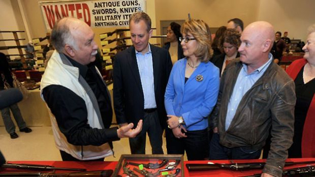 Former Congresswoman Gabrielle Giffords and her husband, Mark Kelly, right, with Saratoga Springs, N.Y., gun show organizer Dave Petronis, left, and New York Attorney General A.G. Schneiderman, second from left,Oct. 13, 2013.