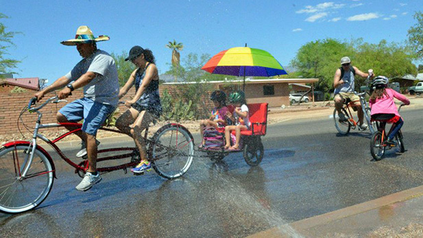 A family participates in Cyclovia 2013.