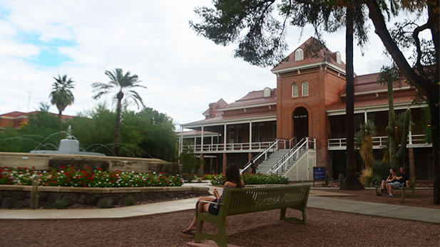 Old Main front, fountain angle students sit SPOT