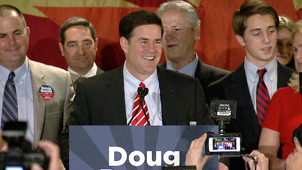 Republican Doug Ducey celebrating Arizona governor's race win at a gathering in Phoenix.