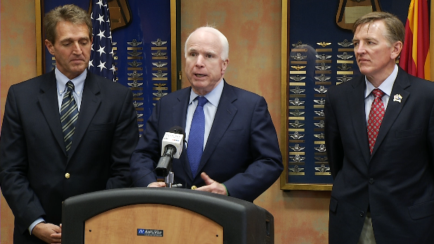 Sens. Jeff Flake (left) and John McCain (center) and Rep. Paul Gosar, at Davis-Monthan Air Force Base Dec. 18, 2014.