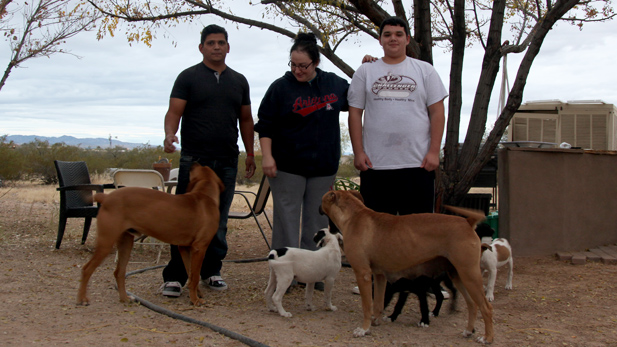 Daniel Neyoy Ruiz with his wife Carla and son Carlos at their home in Tucson.