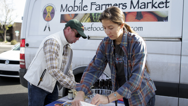 Dan Cornelius, left, and his assistant set up the Mobile Farmers Market at Tucson's Native Seeds/SEARCH.